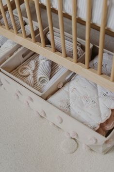 a baby crib with several items in it