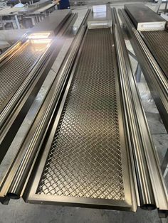 several metal conveyor belt in a factory