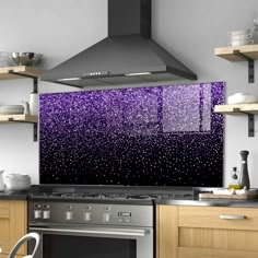 a stove top oven sitting inside of a kitchen under a purple rain droplet wall