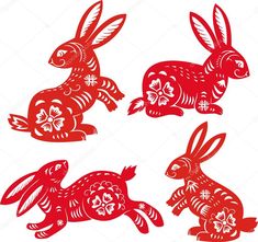 four red paper cut rabbits with flowers on them