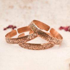 Discover Handcrafted Copper Bracelets, Lovingly Made in Nepal. Elevate Your Style with Boho Essence and Functional Appeal. 🌿 PRODUCT DETAILS: - Handcrafted in Nepal - Made from Pure Solid Copper - Unisex design, Adjustable for a comfortable fit 🌿 ARTHRITIS RELIEF & ONE-OF-A-KIND APPEAL: Our copper bracelets not only add bohemian charm but may offer potential benefits for arthritis pain. Copper's natural properties may help alleviate discomfort, making them both stylish and functional.  Each bracelet is one-of-a-kind, crafted by hand, with delightful variations that enhance authenticity. 🌿 SACRED 8 BUDDHIST SYMBOLS: This exquisite copper bracelet features sacred symbols rooted in Buddhist tradition, representing key aspects of the spiritual journey: 1. The Lotus: Purity, enlightenment. 2