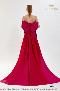 the back of a woman's dress with a large bow at the neckline