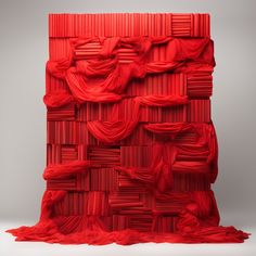 a red piece of art that looks like it is made out of paper