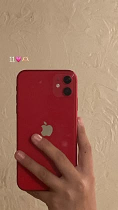 a person holding an iphone in their left hand with the back cover removed from it