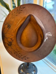 Custom brown hat with hand burned flower detailing and white accents. Adjustable hat with strings in the inside. Hat With Strings, Burned Flower, Brown Hat, Boho Hat, Hat Wide Brim, Leather Hat, Hat Custom, Brown Hats, Leather Hats