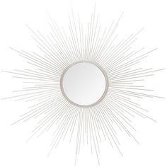 a white sunburst mirror on a wall