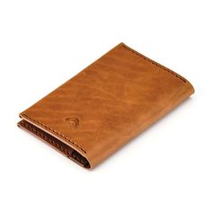 The Passport Wallet keeps your travel essentials organized and within reach while on the move. This portfolio-style wallet features two credit/business card pockets that hold three to four cards each plus two larger pockets to hold a passport, cash, tickets or other documents. Our Italian Horsehide products are made from full grain, vegetable tanned leather hides, imported and handcrafted at the Ezra Arthur workshop in Phoenix, Arizona. Made with 100% real leather and no linings, rubber or glue. Leather Hides, Passport Wallet, Leather Hide, Phoenix Arizona, Malbec, Vegetable Tanned Leather, Travel Essentials, Real Leather, Business Card