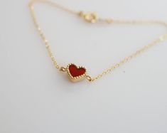 Tiny and dainty red agate heart filled with love and passion, such a perfect present for Valentine's Day and your loved ones. :: Style name: RDHRT-ENLB1004 :: Heart size: 7x7.5mm :: Material: 14k solid yellow gold :: Stone type: red agate Notes :: Jewelries are measured in millimeters and centimeters. :: Please read store policy before placing order. :: In stock items are ready to ship in 3 business days, made to order items are ready to ship in 2-4 weeks. :: International Shipping AVAILABLE. :: Red Heart Charm Fine Jewelry, Red Fine Jewelry With Heart Charm, Red Double Heart Jewelry As Gift For Her, Red Double Heart Jewelry Gift For Her, Red Double Heart Jewelry For Her, Elegant Red Heart Bracelet For Gift, Elegant Red Heart Bracelet Gift, Minimalist Red Heart-shaped Jewelry, Fine Jewelry Heart Bracelet As Gift