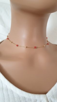 The necklace is made with gold plated chain, Coral beads (4mm) and gold plated brass lobster clasp.  The length of the extension is approximately 2 inches.  Please contact me in case you have any questions. Please note: store your jewellery individually to keep them from scratching each other. Avoid contact with perfume, body lotions, hairspray or any other chemical. Adjustable Chain Choker With Round Beads, Gift Choker With Adjustable Chain And Round Beads, Gold Beaded Minimalist Crystal Necklace, Minimalist Gold Beaded Crystal Necklace, Dainty Gold Crystal Choker Necklace, Beaded Chain Choker Jewelry As Gift, Dainty Gold Beads Choker As A Gift, Gift Delicate Chain Choker With Round Beads, Dainty Gold Beaded Choker As Gift