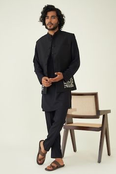 Black bundi with contrast patch abstract embroidery. - Aza Fashions Traditional Black Cotton Nehru Jacket, Traditional Black Nehru Jacket With Stand Collar, Black Nehru Jacket With Stand Collar For Festive Occasions, Abstract Embroidery, Nehru Jacket, Embroidered Silk, Raw Silk, Aza Fashion, Silk