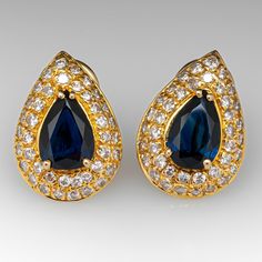 These gorgeous sapphire earrings are each centered with a pear cut sapphire in a four-prong setting. The center is accented by forty (40) bead set, round brilliant cut diamonds. The earrings measure 18.9mm long by 13.6mm wide and 6.2mm deep, finished with omega style clip on backs. We can add a post for pierced ears if you prefer. Elegant Diamond Earrings With Gemstone Accents For Formal Occasions, Elegant Formal Diamond Earrings With Gemstone Accents, Formal Blue Pear-shaped Diamond Earrings, Blue Pear-shaped Diamond Earrings For Anniversary, Formal Teardrop Sapphire Earrings, Formal Diamond Earrings With Gemstone Accents, Formal Sapphire Diamond Earrings With Diamond Accents, Sapphire Pear-shaped Earrings Fine Jewelry, Classic Sapphire Earrings With Diamond Accents