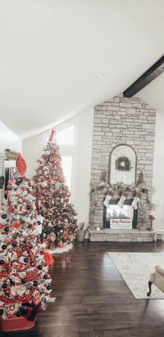 a living room decorated for christmas with red and white decorations