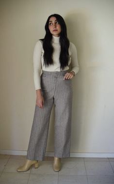 High Waisted Plaid/Gingham 70s Flare Trousers Brand: No brand listed, I believe these were handmade. Fabric: Unknown, a fabric similar to wool but less thick and not itchy. Condition: Great Size: no tag, Size small Length: 41' ( model's height is 5'4 for reference) Waist: 27' 70s Inspired Cotton Pants For Fall, Retro Plaid Pants For Fall, 70s Inspired Cotton Bottoms For Fall, Vintage Plaid Pants For Fall, Vintage Plaid Pants For Work, Retro Fitted Wool Bottoms, Vintage Plaid Bottoms For Work, Gingham Cotton Pants For Fall, Fitted Gingham Pants For Fall