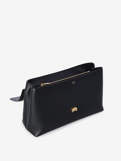 This bag is like that effortlessly chic friend who always knows what to wear—timeless and sophisticated without trying too hard. Made in Italy with care, it's perfect for days when you need a little extra room without compromising on style. The subtle gold-tone accents and smooth calfskin make it a versatile companion for any occasion. Crafted from black grained calfskin Sliding chain shoulder strap for versatile wear Magnetic closure with gold-tone Triomphe detail Two main interior compartments Popular Bags, Metal Detail, Celine Bag, By Your Side, Large Bag, Parisian Style, Natural Leather, Gold Tone Metal, Magnetic Closure