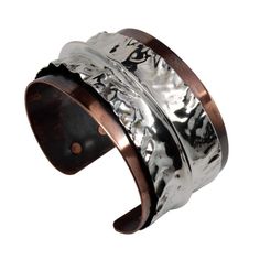 This extra-funky copper cuff bracelet features a layer of brilliant Argentium Silver that was hand-molded to perfection. The copper base layer was antiqued for extra drama. The mixed metal helps this bracelet flow seamlessly with a wide variety of looks. 6 inches, adjustable This bracelet is made to order. Production time is two weeks. Due to handmade craftsmanship, please expect slight variations from the photo. Unique Hand Forged Cuff Bracelet For Formal Occasions, Unique Hand Forged Cuff Bracelet For Formal Events, Luxury Wide Band Cuff Bracelet As Gift, Luxury Wide Band Cuff Bracelet Gift, Elegant Hand Forged Cuff Bracelet, Unique Cuff Bracelet For Formal Occasions, Elegant Hand-cast Cuff Jewelry, Luxury Hammered Cuff Bracelet, Luxury Hammered Bangle Cuff Bracelet