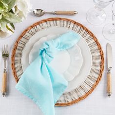 a place setting with napkins and silverware