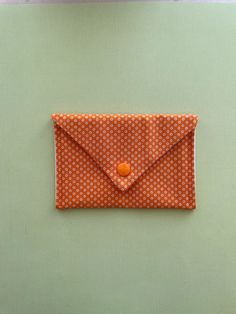 "This is a sweet, little multi-purpose \"wallet\".  It can be used for holding business cards, credit cards, money, lipstick, driver's license, or a few pieces of jewelry for your carry-on.  A great \"gift-within-a-gift\" when used to deliver a gift card...a cute \"envelope\" that can be used when the gift card is just a memory!  Win-Win! This little fabric wallet is perfect to tuck into a backpack, carry-on, diaper bag, purse, fanny pack or even your pocket. Being handmade, each will vary a bit Cute Rectangular Card Holder For Daily Use, Orange Rectangular Wallets With Card Slots, Orange Rectangular Card Holder With Card Slots, Orange Rectangular Card Holder With Slots, Gift Wallets With Cell Phone Pocket In Clutch Shape, Orange Rectangular Coin Purse For Daily Use, Personal Coin Purse Clutch With Card Slots, Handmade Envelope Clutch For Gift, Handmade Envelope Clutch As Gift