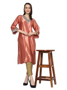 Elevate your wardrobe with our exquisite Pink Gotta Patti Work Kurta. Hand-embroidered on the front, this piece exudes elegance and charm. Crafted from sustainable Mashroo cotton silk Kutchi material, it not only adds style to your ensemble but also contributes to a more eco-conscious lifestyle. Each piece is a testament to skill empowerment for artisans, ensuring that their craftsmanship is celebrated and sustained. This royal, timeless garment is perfect for any occasion, be it a party, weddin Diwali Kurta With Mirror Work, Art Silk Palazzo Set With Straight Kurta, Festive Unstitched Kurta, Festive V-neck Kurta With Zari Work, Fitted Straight Kurta Tunic For Festive Occasions, Straight Kurta For Navratri Party, Festive V-neck Kurta For Diwali, Navratri Party Straight Kurta, Festive Dabka Palazzo Set