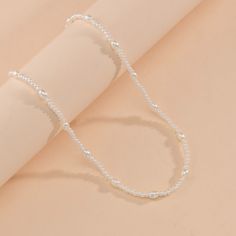 Material: Imitation pearl Color: White Fashion Element: Ellipse Style: Europe and America Elegant Pearl Chain Necklace With Silver Chain, Dainty Silver Beaded Necklace With Pearl Chain, Pearl Beaded Necklace With Chain, Elegant Alloy Chain Pearl Necklace, Elegant Alloy Pearl Chain Necklace, Elegant Alloy Chain Necklace With Pearl Chain, Elegant Alloy Pearl Necklace With Chain, Elegant Pearl Necklace With Alloy Chain, Silver Dainty Beaded Pearl Necklace