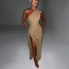 Features: Introducing our Elegant Backless Sexy Maxi Dress for Women, featuring a diagonal collar and sleeveless design for a sleek and alluring look. Perfect for any party or club event, this dress also boasts a thigh-high split and bodycon silhouette for a trendy and figure-flattering fit. Elevate your fashion game with this must-have piece. Glamorous Stretch One Shoulder Dress For Evening, Glamorous Stretch One Shoulder Evening Dress, Glamorous Stretch One-shoulder Evening Dress, Asymmetrical Neckline Stretch Bodycon Party Dress, Fitted One-shoulder Evening Dress For Night Out, Asymmetrical Stretch Bodycon Dress For Party, Glamorous Backless One Shoulder Evening Dress, Glamorous Sleeveless One Shoulder Club Dress, Glamorous One Shoulder Dress For Club