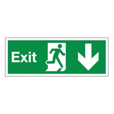 a green exit sign with an arrow pointing to the left and a man walking down it