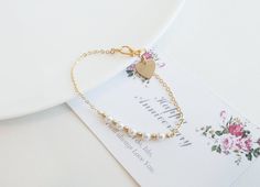 This  beautiful small pearl bracelets is  hand-crafted using Freshwater Pearl /Premium Crystal Pearl, gold filled Beads, gold filled Heart charm and gold vermeil clasp. This wedding pearl jewelry is Perfect for  bridesmaid gift, birthday gift and friends or any occasion. Bracelet Length :   15cm, 16cm, 17cm, 18cm, 19cm. Material: Gold vermeil clasp, gold filled chain , 2.5-3mm gold filled beads,  gold filled Heart charm. Pearl:  4mm Premium Crystal Pearl or 4-4.5mm Freshwater pearls Dainty Pearl Beaded Bracelets For Wedding, Wedding Bracelets With Pearl Charm, White Heart-shaped Bracelet For Weddings, White Heart Bracelet For Wedding, White Heart-shaped Wedding Bracelet, Elegant Gold Heart Bracelet For Wedding, Pearl Bracelets For Bridesmaid Gift, Heart Charm Bracelet For Wedding And Mother's Day, Heart Charm Bracelets For Wedding And Mother's Day