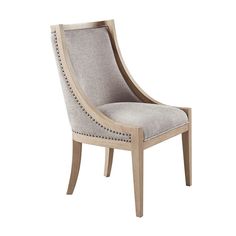 an upholstered wooden chair with grey fabric and studding on the armrests