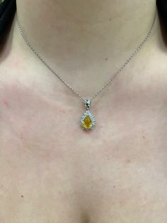 "14k white gold Pear shape/ Tear Drop Yellow Sapphire with Diamond Halo Pendant.  Material: 14k Solid white gold.  Center Stone: Natural Pear Yellow Sapphire.  Yellow Sapphire Weight: 2.06 Carats. Diamonds: 0.83 carats. Diamond Quality: VS2-SI1. Length: Top of the bail to the bottom approximately 1\". Actual Halo Stud is a little over .50 inches. Comes in a nice box.  Chain Included, select 16, 18, or 20\" at check out." Pear-shaped White Gold Necklace With Diamond Accents, Silver Platinum Pear-shaped Necklace, Pear-shaped White Gold Sterling Silver Necklace, Pear-shaped Platinum Silver Necklace, White Gold Diamond Necklace With Teardrop Gemstone Pendant, Dazzling Teardrop White Gold Diamond Necklace, White Gold Pear-shaped Diamond Necklace, Pear-shaped White Gold Necklace For Gift, Pear-shaped White Gold Diamond Necklace