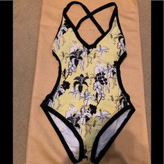 Calvin Klein Adorable 1pc. Criss Cross Open Back Swimsuit W/Bikini Style Bottom, This Has Been Washed But Never Worn. It Is A Size 10 But Runs Super Small, It Fits Like A Size 8. My Intention Was To Keep It And Lose A Little Weight And That Never Happened! The Colors Are Black, White, And Lemon Yellow, Excellent Condition. Yellow Stretch One-piece Beachwear, Yellow One Piece Swimwear For Beach, Calvin Klein Swimwear For Swimming, Yellow One-piece Beachwear For Swimming, Yellow Beachwear One Piece For Swimming, Yellow Beachwear One-pieces For Swimming, Yellow Beachwear One Piece For Poolside, Yellow Beachwear One-piece For Poolside, Yellow Lined Swimwear For Vacation