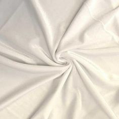 Stretch velvet fabric is a 4-way stretch fabric with a smooth back and textured polyester velvet front. This fabric is extremely soft with a beautiful sheen. This is a medium weight fabric of 253 gsm (approx.) with a 90% polyester 10% spandex content and 58/60" width. The polyester content makes it ideal for washing. This fabric is great for apparel, costumes, dance wear, decorations and more. The velvet has a soft texture, drapes very well with hemmed edges. Its wide width also makes it an idea Stylish Loungewear, Leotard Tops, Fabric For Sewing, Velour Fabric, Stretch Velvet, Crushed Velvet, Soft Textures, Velvet Fabric, Dance Wear