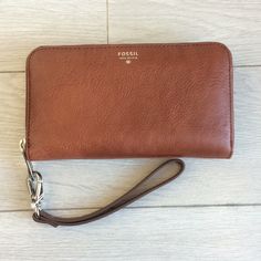 Never Used. Fossil Wristlet/Wallet. Able To Remove Wrist Strap To Use Just As A Wallet. Able To Fit Iphone 6 Inside. Elegant Brown Wristlet For Everyday Use, Formal Brown Wristlet With Wrist Strap, Classic Wristlet For Everyday Use, Classic Clutch Wristlet For Travel, Classic Travel Clutch Wristlet, Classic Travel Wristlet Clutch, Classic Wristlet With Wrist Strap For Daily Use, Classic Everyday Wristlet, Classic Everyday Wristlet With Wrist Strap