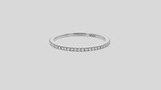 a white gold wedding band with diamonds on the side, set in 18k white gold