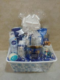 a gift basket filled with personal care products and gifts for someone's special occasion