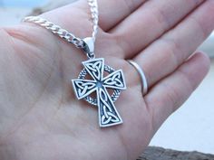 "This sterling silver pendant is just Amazing!! this Celtic Cross necklace is not just beautiful in design but also in meanings, this pendant is a symbol which emphasizes the endlessness of love of God shown through the sacrifice of Jesus on the Cross. The Celtic knot at the bottom of the cross represents friendship, affection, that cannot be broken. The trinity design on the arm of the Cross symbolizes God's love around the Holy Trinity. Also, It represents the three promises of a relationship Handmade Stainless Steel Cross Jewelry, Hallmarked Sterling Silver Cross Necklace, Silver Cross Pendant Jewelry, Silver Symbolic Cross Necklace, Nickel Free Sterling Silver Cross Necklace, Sterling Silver Nickel-free Cross Necklace, Nickel-free Sterling Silver Cross Necklace, Hallmarked Silver Cross Necklace, Silver Hallmarked Cross Necklace