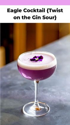 a purple cocktail in a wine glass with a flower on the rim and text eagle cocktail twist on the gin sour