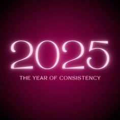 the year of constiency in neon pink and black text on a dark background