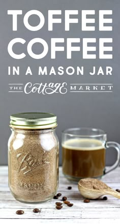 a mason jar filled with coffee next to a cup of coffee