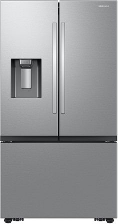 a silver refrigerator freezer sitting next to a white wall with an ice dispenser on the door