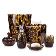 the bathroom accessories are all made up of tortoise shell