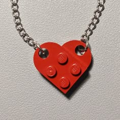 The necklace is handmade by AFOL (An Adult Fan of LEGO) using LEGO plates with a 20inch stainless steel linked chain. May have imperfections. Red Pendant Charm Necklace In Metal, Red Metal Pendant Charm Necklaces, Red Metal Pendant Charm Necklace, Red Stainless Steel Jewelry For Valentine's Day, Red Stainless Steel Pendant Jewelry, Red Metal Charm Necklace With Adjustable Chain, Nickel Free Red Metal Charm Necklaces, Red Pendant Chain Jewelry, Red Pendant Necklace With Chain