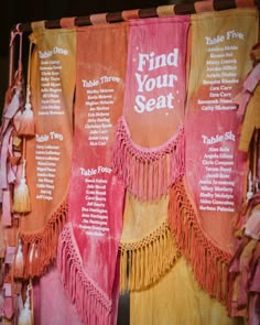 an assortment of tassels on display in a store window with the words find your seat