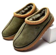 UGG TASMAN WOMEN'S SIZE 8 BURNT OLIVE SUEDE SHEEPSKIN CLASSIC SLIPPERS THIS ITEM SOLD OUT!! BRAND NEW NEVER WORN 100% AUTHENTIC GUARANTEED  WITH THE UGG HOLOGRAM ALWAYS LOCATED IN THE LEFT SHOE FOR AUTHENTICITY PLEASE REVIEW OUR FEEDBACK  USA TRUSTED SELLER  COMES IN ORIGINAL RETAIL PACKAGING  THAT INCLUDES ORIGINAL RETAIL BOX, AND ALL FACTORY LITERATURE.  Have questions/concerns? You can send us a message and we will respond within 24 hours or Less  Returns are acceptable within 30 days in unwo Tasman Uggs, Olive Shoes, Ugg Slipper, Aesthetic Wardrobe, Tasman Slippers, Ugg Tasman Slippers, Fancy Footwear, Classic Slippers, Comfy Slippers