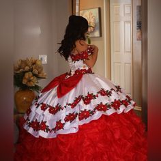 a woman in a red and white dress