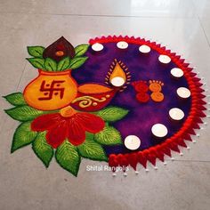 a colorful rangdi with candles on the floor