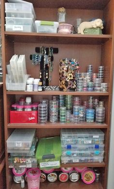 the shelves are full of craft supplies and other items for storage in this closet area