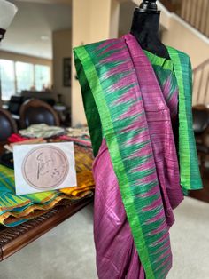 A beautiful raw Tussar silk saree in purple and green. Odisha silk with temple border, comes with a stitched blouse Purple Saree With Weaving Work For Festive Occasions, Festive Purple Raw Silk Saree, Bollywood Style Purple Saree With Weaving Work, Purple Handloom Tussar Silk Traditional Wear, Purple Tussar Silk Handloom Traditional Wear, Purple Tussar Silk Traditional Wear With Weaving Work, Purple Saree With Weaving Work, Green Raw Silk Saree With Weaving Work, Purple Art Silk Saree With Weaving Work