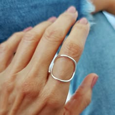 This ring is becoming my favorite very quickly! This minimalist large circle ring design goes well with everything I wear and has that effortless chic look. It is very comfortable to wear as it hugs your index finger in a very delicate and soft way. The width of the circle is about 1 inch. If you need a smaller circle, please contact me and I will be happy to make it for you. I let the smooth finish of the natural sterling silver shine and just hammered the band which is a bit thinner that the c Everyday Minimalist Hammered Midi Rings, Silver Hammered Minimalist Midi Rings, Modern Nickel Free Stackable Rings, Nickel-free Minimalist Midi Rings, Modern Handmade Stackable Rings For Everyday, Handmade Simple Midi Rings, Modern Nickel-free Open Midi Rings, Minimalist Open Circle Ring For Everyday, Handmade Modern Sterling Silver Midi Rings