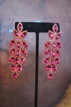 Pink Chandelier Earrings With Rhinestones For Party, Hot Pink Prom Jewelry, Pink Dangle Chandelier Earrings For Evening, Pink Chandelier Party Earrings, Glamorous Pink Chandelier Earrings For Evening, Pink Party Chandelier Earrings With Rhinestones, Pink Bling Crystal Earrings For Wedding, Pink Rhinestone Chandelier Earrings For Party, Pink Crystal Bridal Earrings For Party