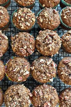 muffins cooling on a wire rack with other muffins in the background