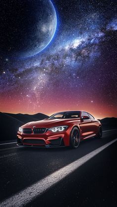 a red car driving down a road under a night sky filled with stars and planets